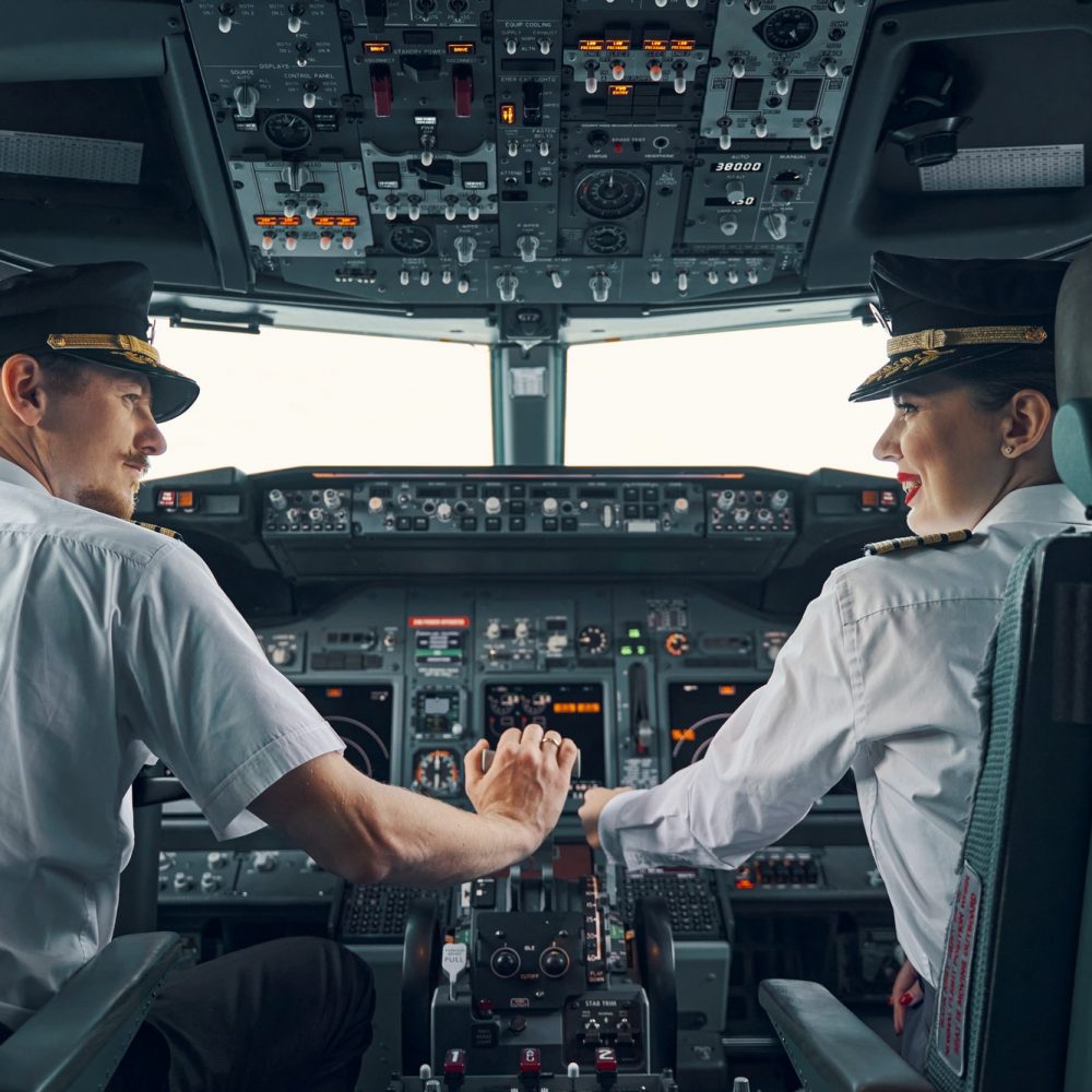 two-professional-aviators-sitting-in-the-cockpit-during-the-take-off.jpg